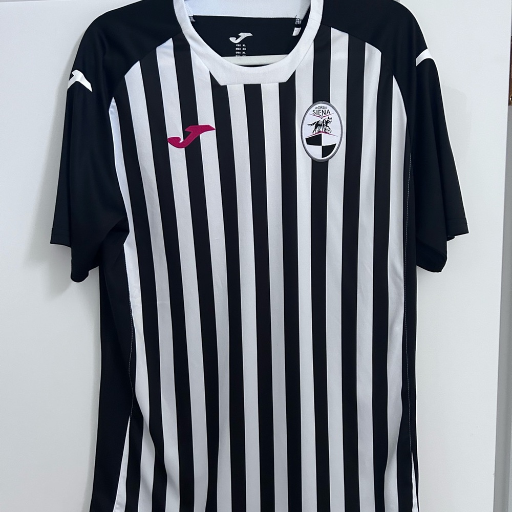 Five soccer jerseys of various sizes.